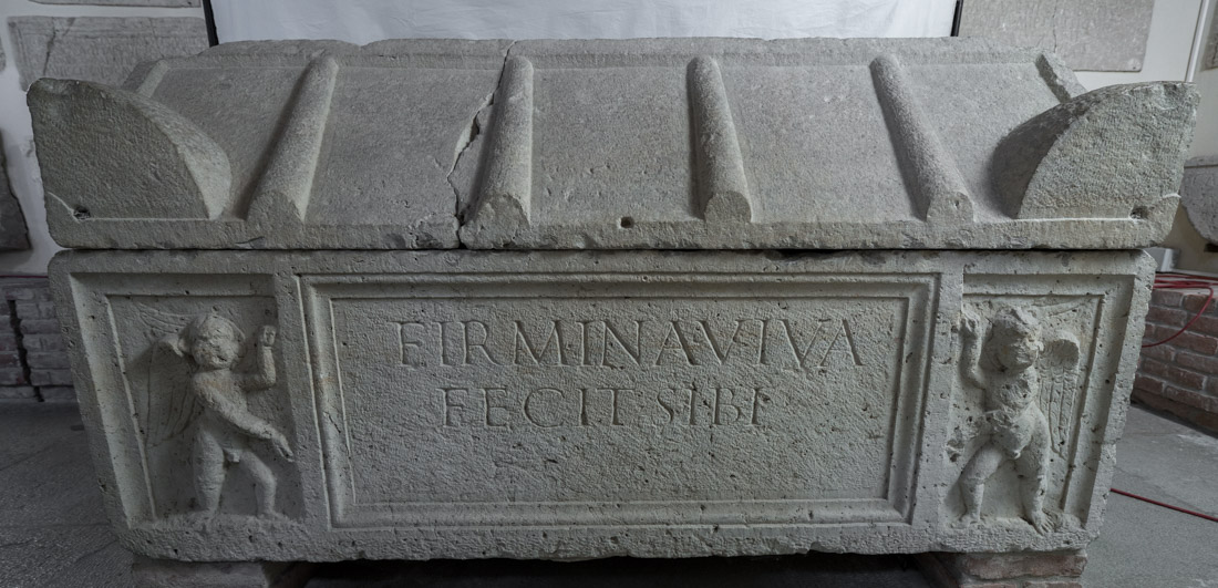 Limestone sarcophagus with inscribed front.
