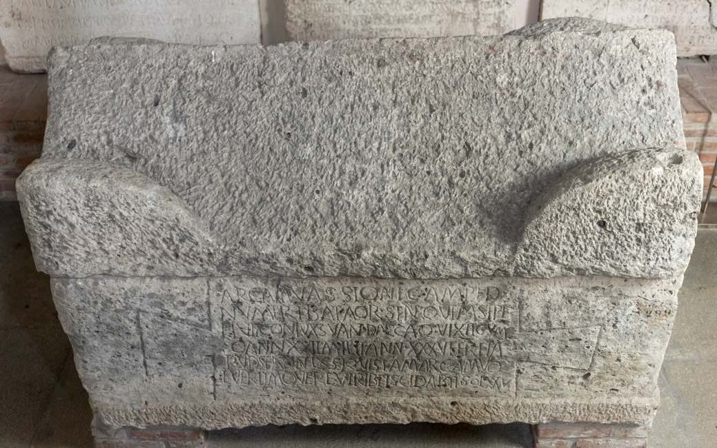 Limestone sarcophagus with inscribed front.